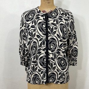 i.e. woman black/gray/white floral jersy knit with a burgandy fr trim/buttons